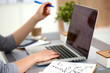 © lenetsnikolai - Young businesswoman working on a laptop