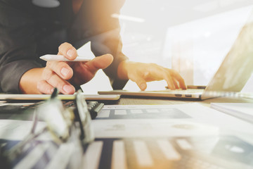 business documents on office table with laptop computer with sma