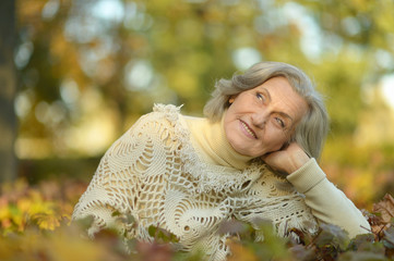 Wall Mural - Senior woman in autumn park