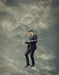 Businessman Walking on a Rope-Risky Business Concept