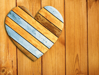 Wooden heart on old wood wall