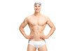 © Ljupco Smokovski - Young handsome swimmer posing in white swim trunks