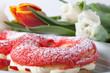 © strannik_fox - Homemade custard cakes with cream and bunch of spring tulips on