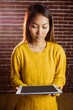 © WavebreakmediaMicro - Focused asian woman using tablet