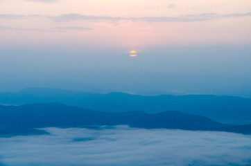 Wall Mural - sunrise over mountain and mist in the morning at sri nan national park thailand
