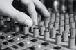 © fantom_rd - man sets up the mixer to adjust the sound and recording