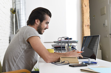 Wall Mural - student preparing exam relaxed or informal hipster style businessman working with laptop computer