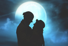 Silhouettes Of A Couple With Starry And Lunar Background. 
