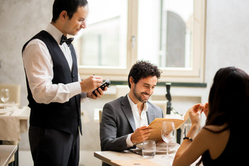 Waiter taking orders in a restaurant