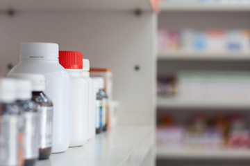 bottles on pharmacy store shelf