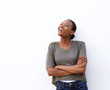 Laughing young african woman against white background