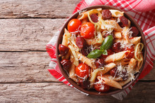 Penne Pasta With Sausage, Leeks, Cheese And Tomato. Horizontal Top View

