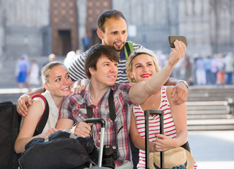 Wall Mural - Group of tourists making selfie