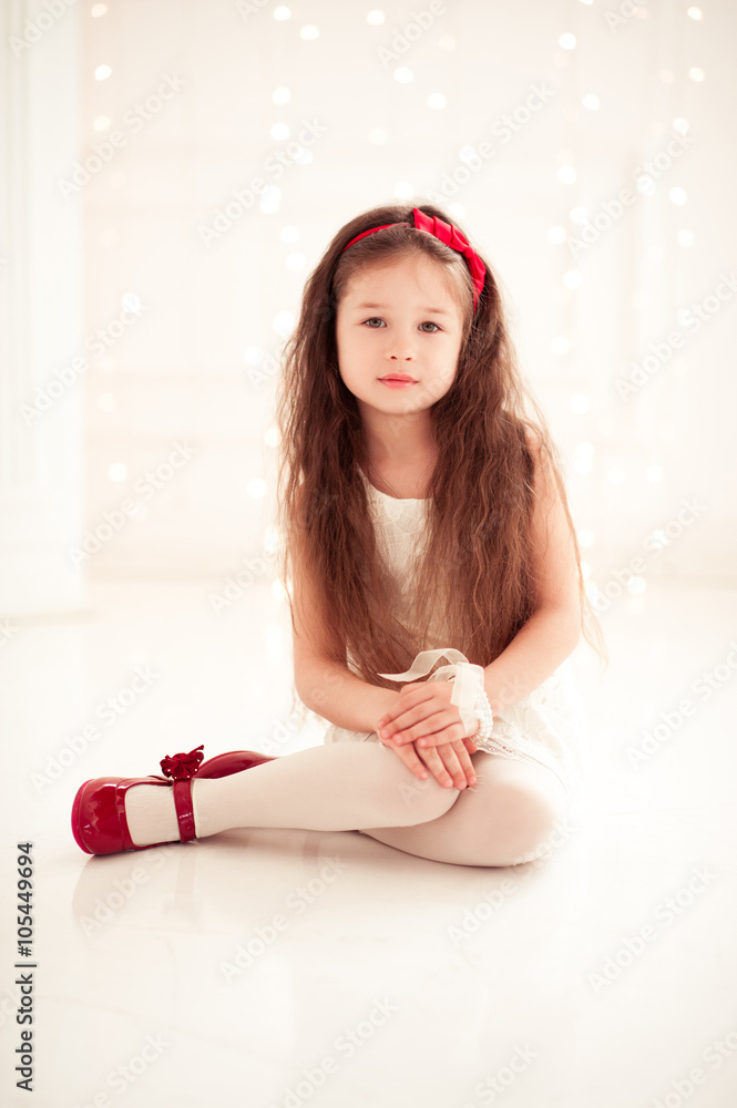 6 year old girl naked Cute kid girl 5-6 year old wearing stylish clothes sitting on floor in room  over white. Looking at camera. Childhood. Stock Photo | Adobe Stock