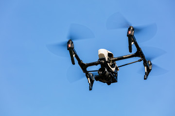 Wall Mural - drone flying against blue sky background