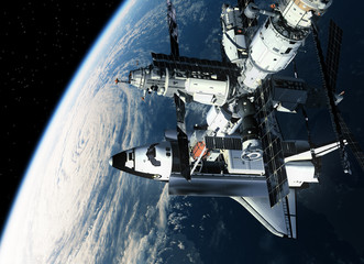 Wall Mural - space station and shuttle orbiting earth