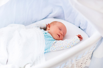 Canvas Print - Cute newborn baby in white bed