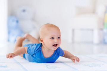 Wall Mural - Baby boy in white nursery