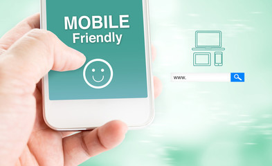 hand touch mobile phone with mobile friendly word with search bo