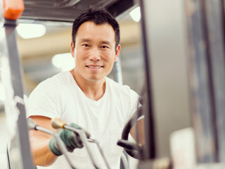 Asian worker in production plant on the factory floor