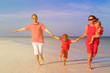 © nadezhda1906 - family with two kids having fun on tropical beach