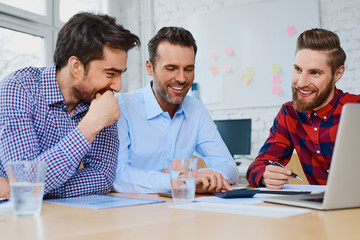 Canvas Print - Group of employees doing business analisis  in office