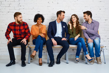 Canvas Print - Group of happy young people waiting for exam at university