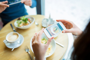 Sticker - close up of couple picturing food by smartphone