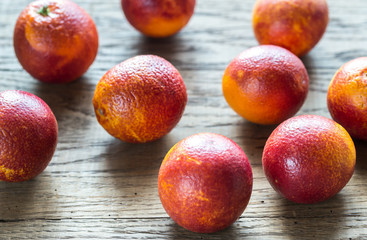 Canvas Print - Red tangerines on the wooden background