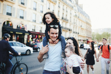 Big family walking the streets in Paris