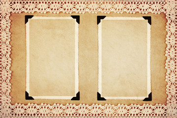 Two blank retro photo frames on decorative paper framed with lace. Grunge style.