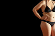 © agenturfotografin - Womans body in bikini with excessive fat on waist and stomach, isolated, white background, text or copy space.