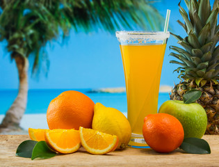 Wall Mural - orange juice in a glass on a table