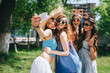 four beautiful girls hippies doing selfie outdoors