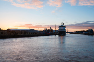 Sunrise over sea port