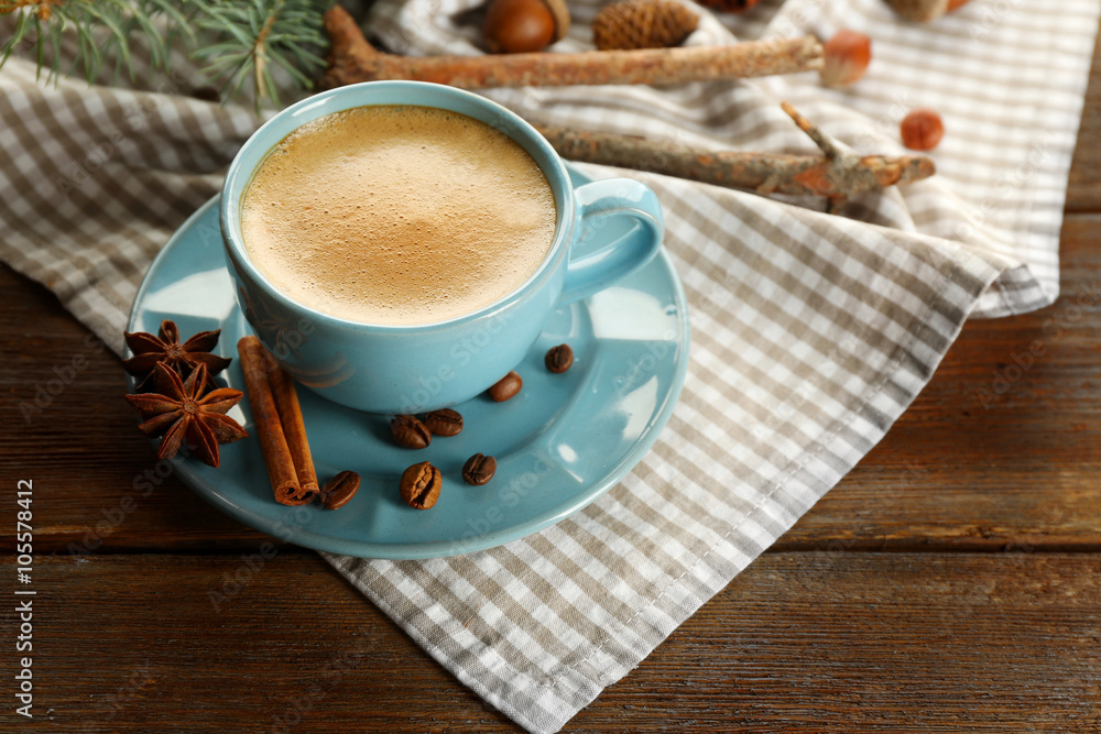 Cup of coffee and Christmas tree branch on napkin