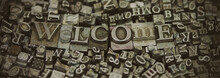 Close Up Of Typeset Letters With The Word Welcome