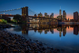 Fototapeta  - Brooklyn Bridge and Manhattan skyline in New York City over the East River at night