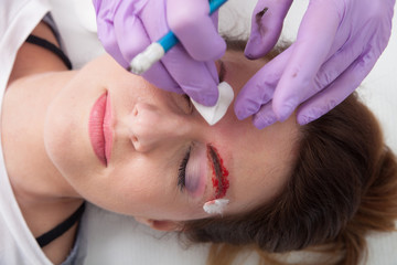 Wall Mural - A woman getting permanent make up