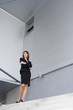 © plprod - femme d'affaire debout souriante