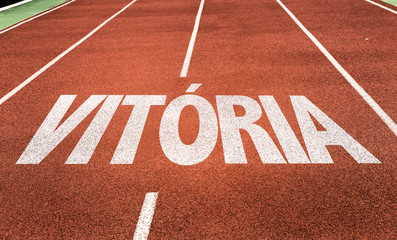 Wall Mural - victory (in portuguese) written on running track