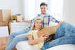 © Syda Productions - happy couple with big cardboard boxes at new home