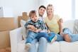 © Syda Productions - happy family with boxes moving to new home