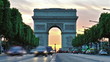 Timelapse of Arc De Triumph with gorgeous sunset behind, seen from Champs Elysees, Paris, France