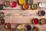 Fototapeta Nowy Jork - Spices in jars on wooden background. Food