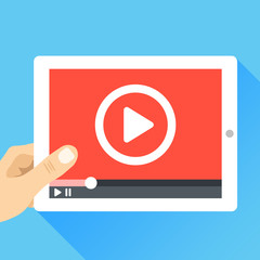 Wall Mural - hand holding tablet with video frame and play button. video marketing, online cinema. modern flat il