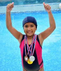 Girl in swimsuit with medals