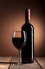 Wall Mural - Red wine bottle and glass