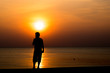 © exzozis - man smoking and sunset silhouette at the beach