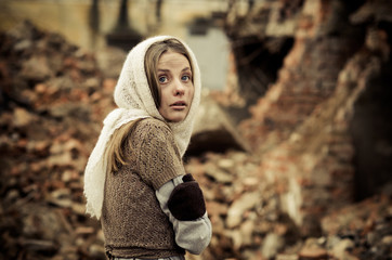 young girl dressed in the poor sweater and scarf